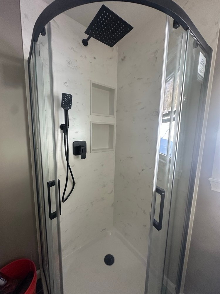 Finished walk-in shower with tile surround