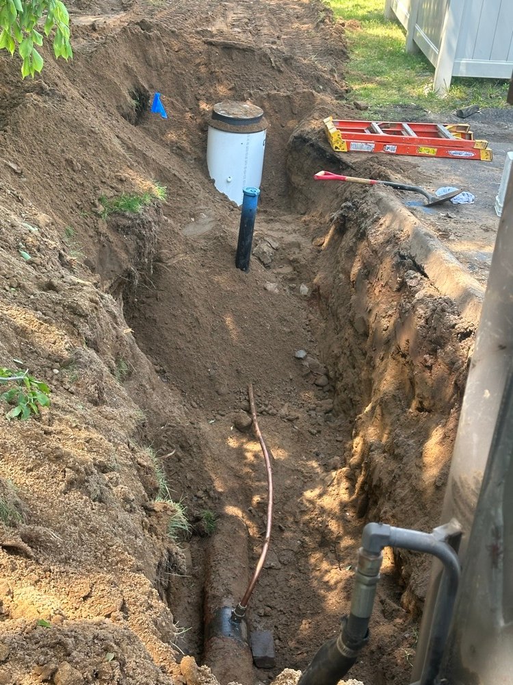 Sewer cleanout riser pipe installed in trench