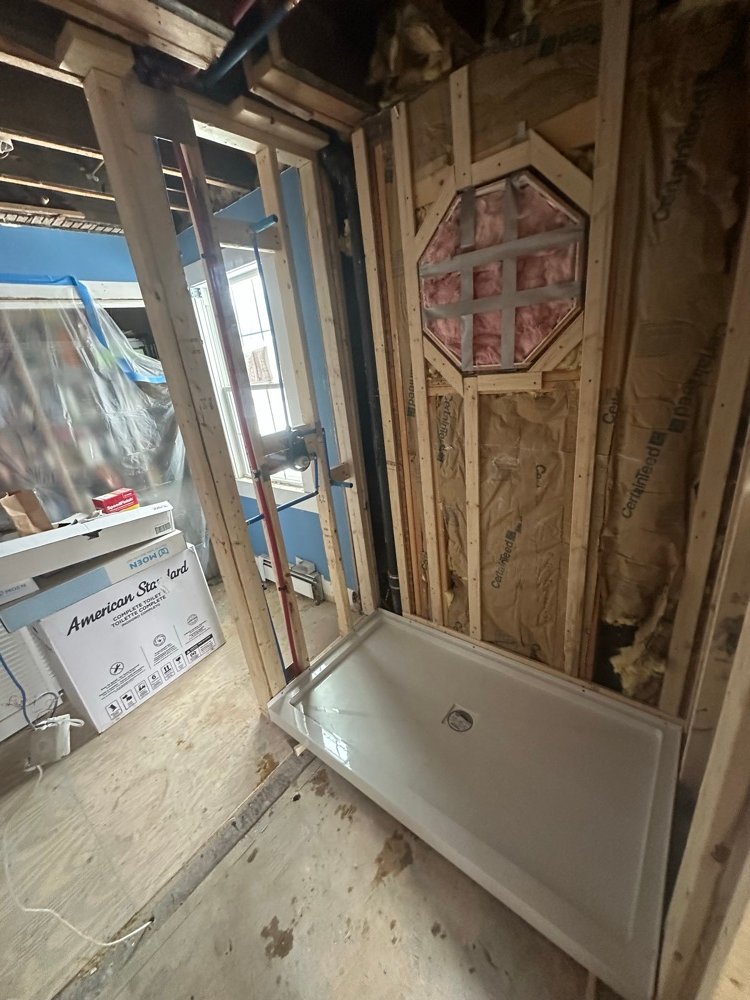 New construction bathroom rough-in with shower pan